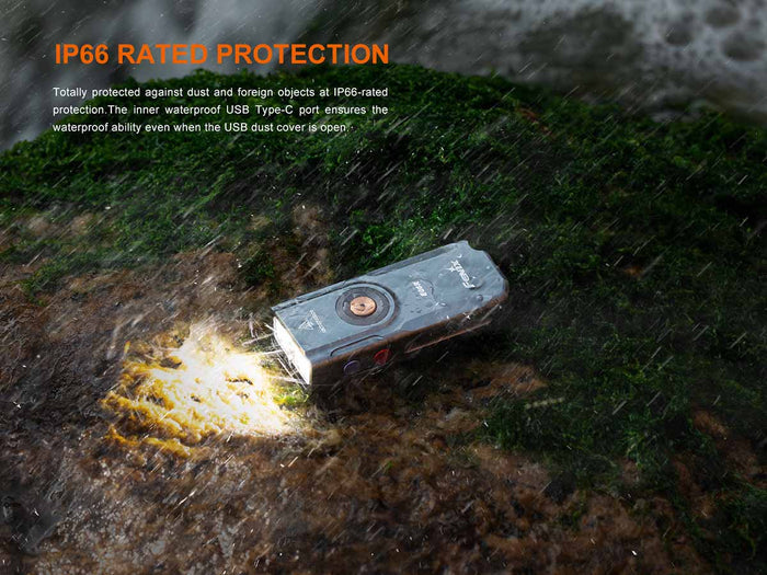 Fenix E06R flashlight on a rocky surface with rain effects and text about IP66 rated protection