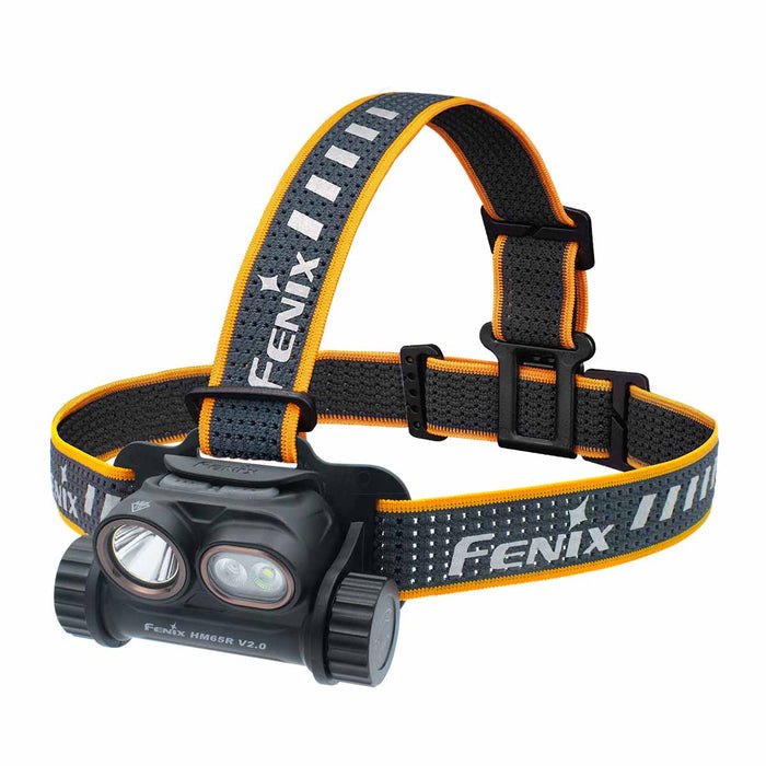The Fenix HM65R V2.0 headlamp with a black body and dual LED lenses, attached to an elastic strap with black, gray, and orange panels and white Fenix branding.